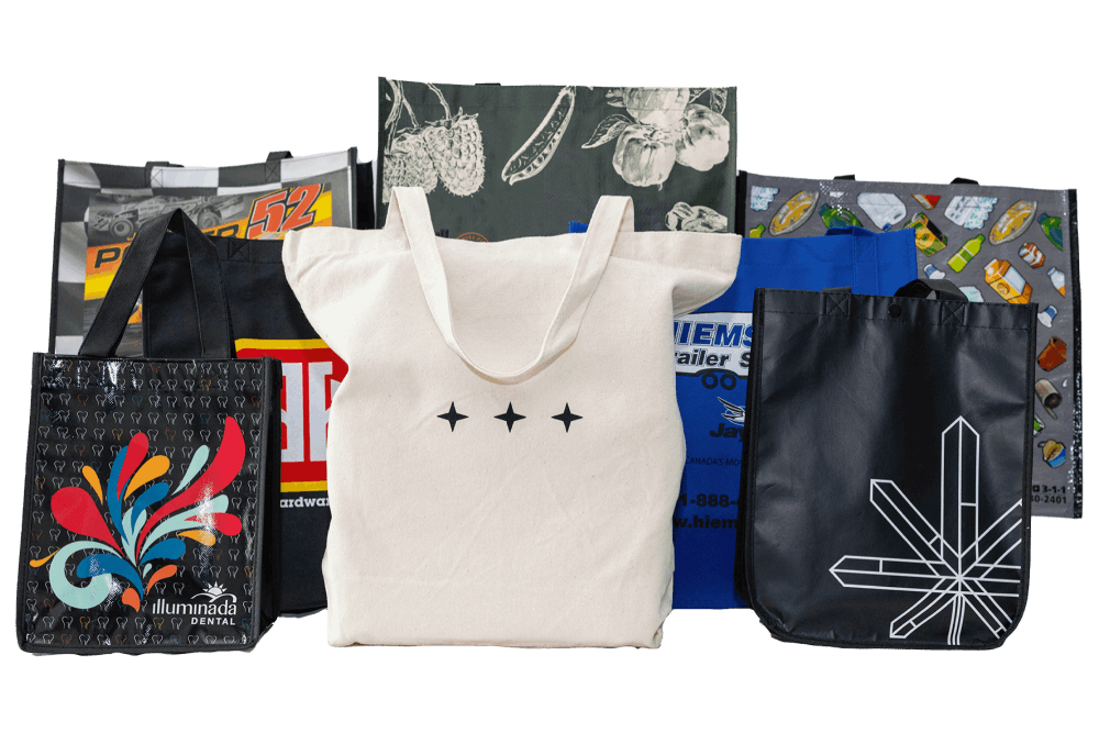 a group of reusable grocery bags with different designs