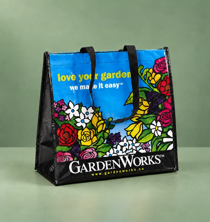 GardenWorks woven shopping bag on a green studio background
