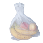 White reusable mesh produce bag filled with bananas and other fruit